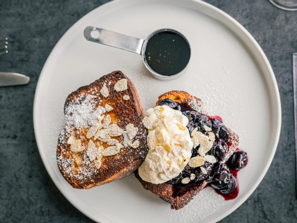 French toast with fruit, cream and toasted almonds