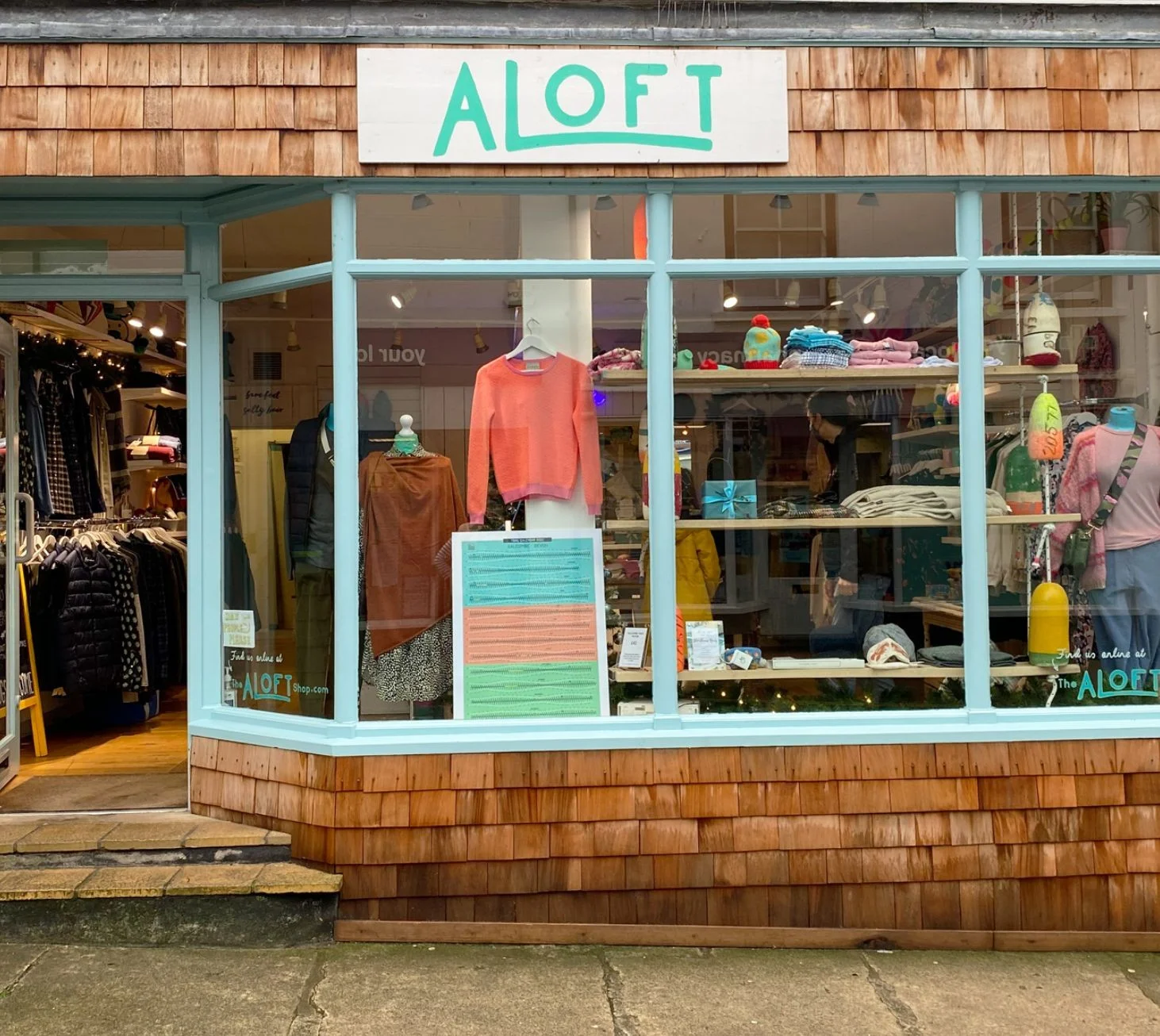 Turquoise Aloft shopfront with clothing displayed in the window