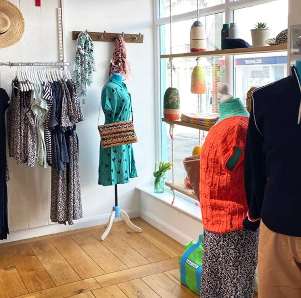 Clothing and accessories displayed inside Aloft Salcombe