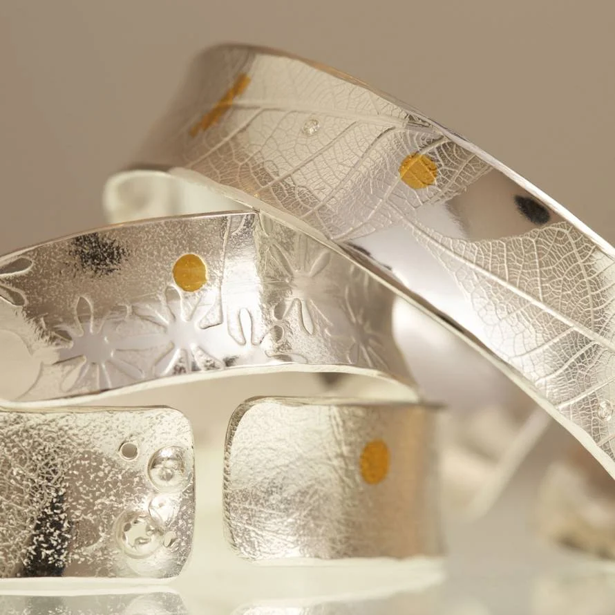 Textured metal cuffs and rings by April Doubleday