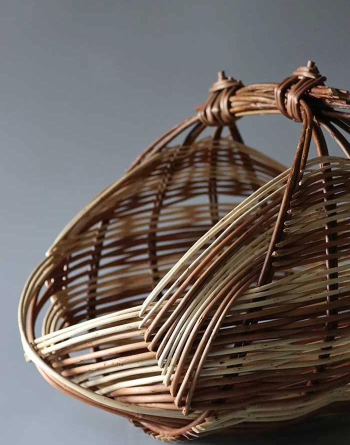 A woven willow basket by Lucy Turner