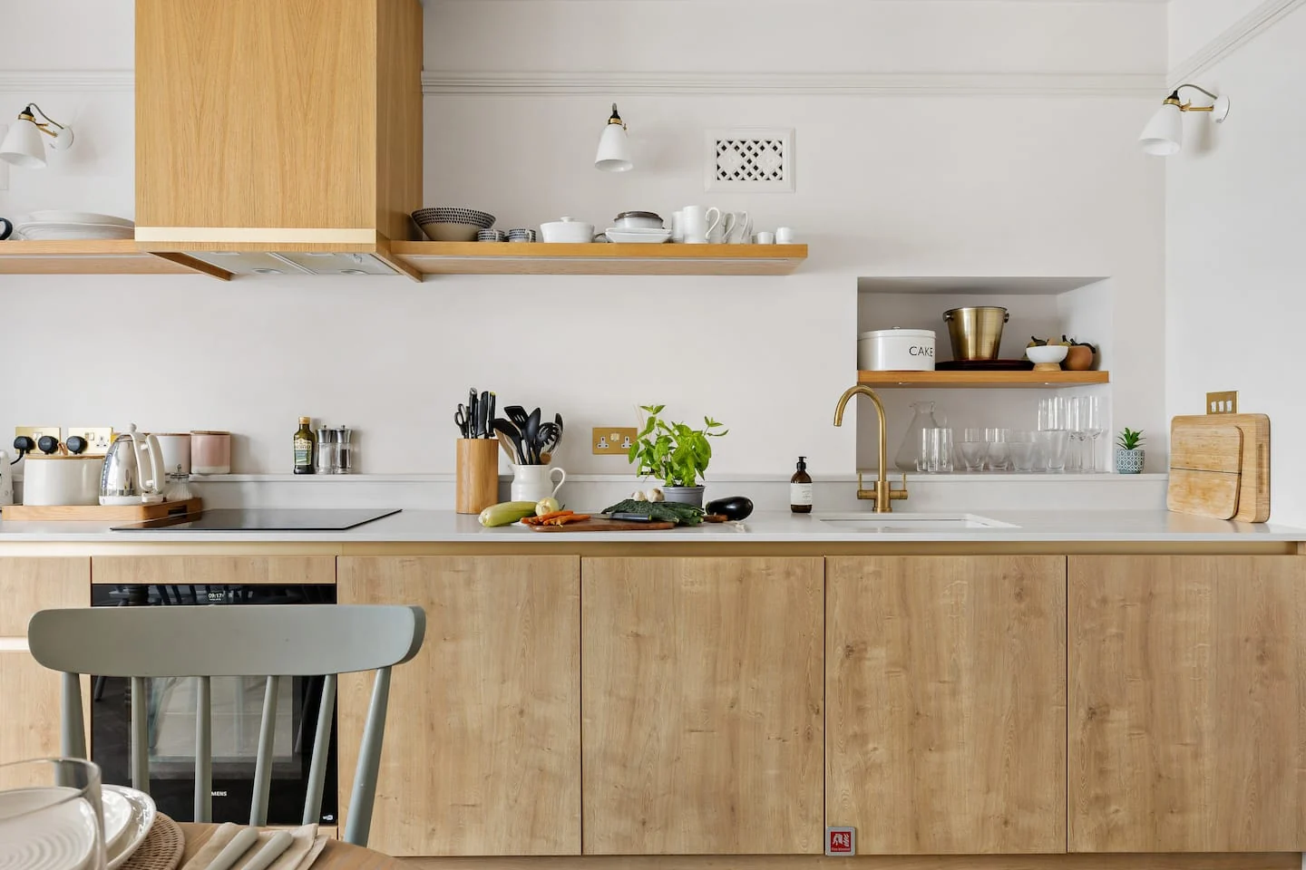 Open kitchen shelves and a wooden worktop