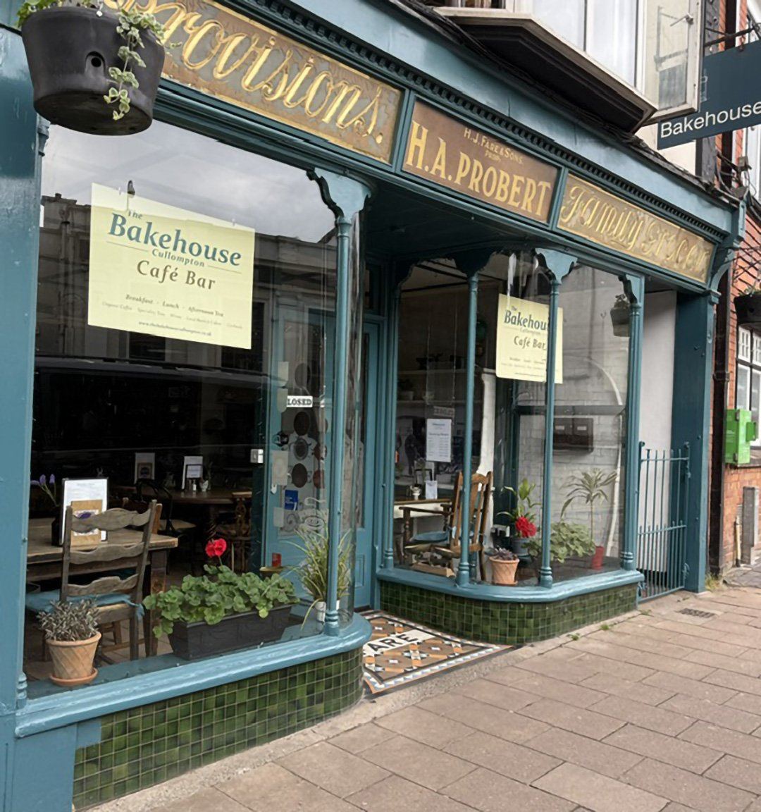 Green traditional shopfront of The Bakehouse in Cullompton