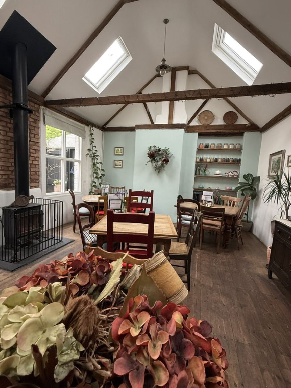 Timbered ceiling and wooden tables at The Bakehouse