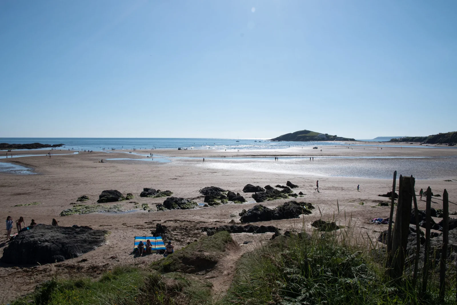The sand and sea at Bantham Beach, with Burgh Island beyond