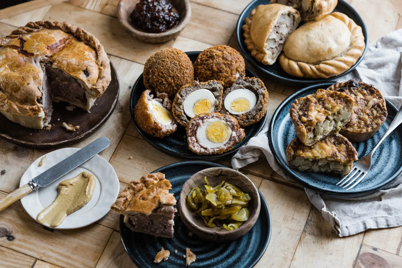 Ben’s handmade pies, pasties and Scotch eggs arranged on a table