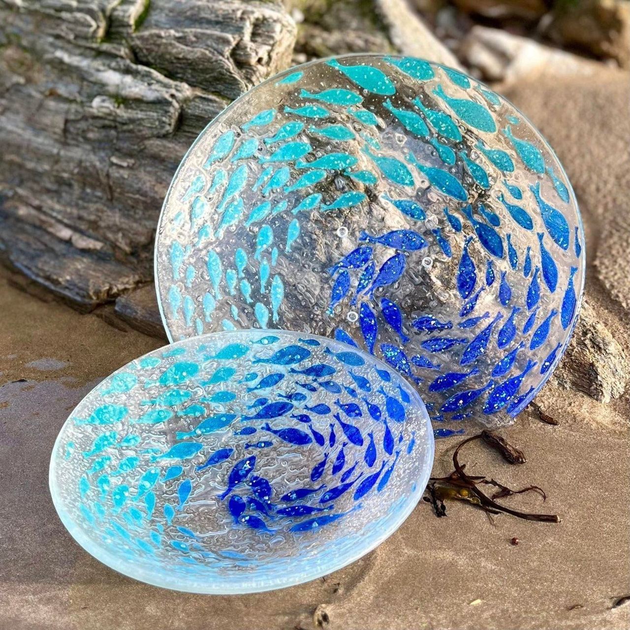 Blue and turquoise glass bowls made by Berserks