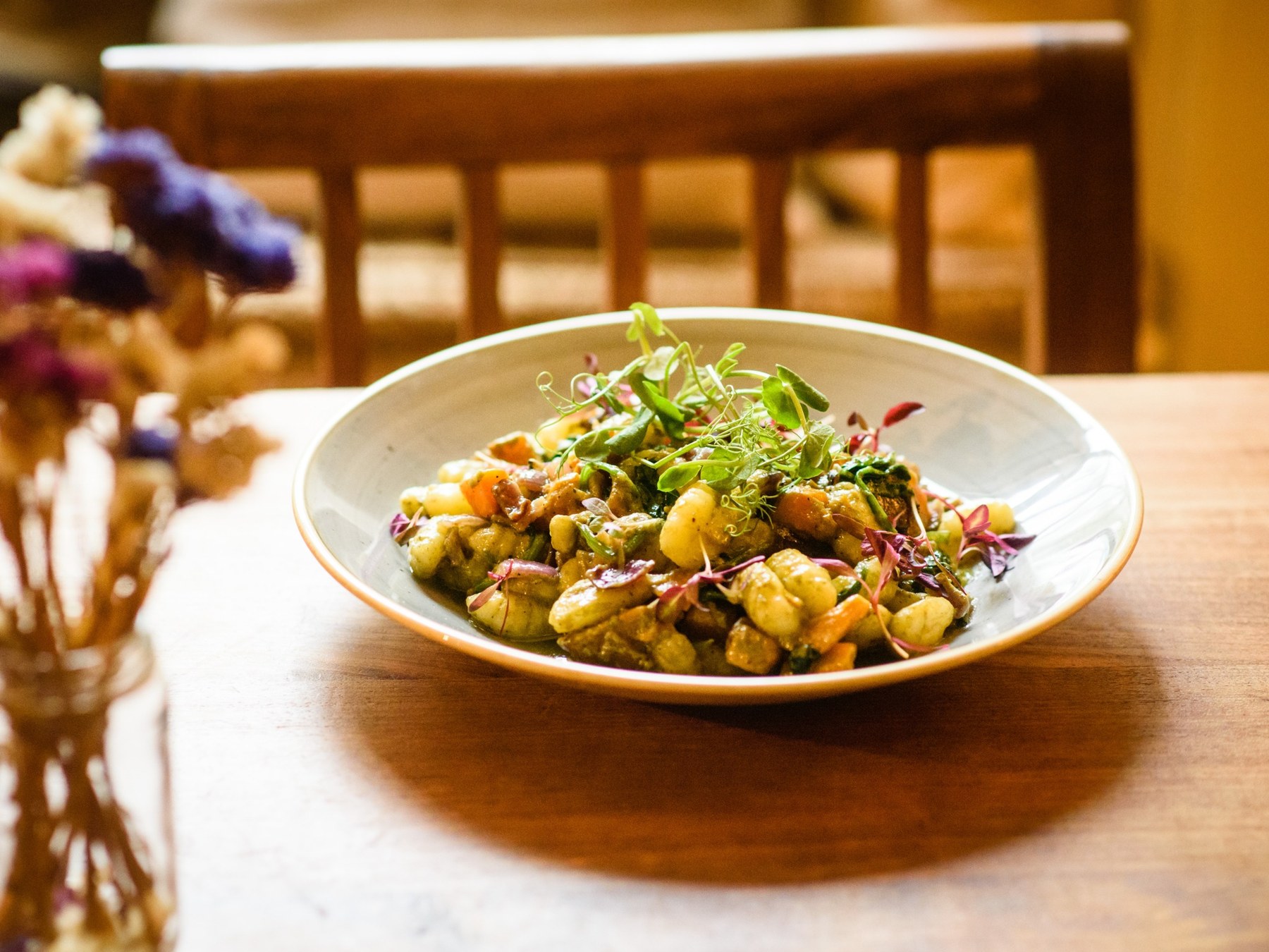 Colourful plated food on a wooden table in Bickley Mill Inn