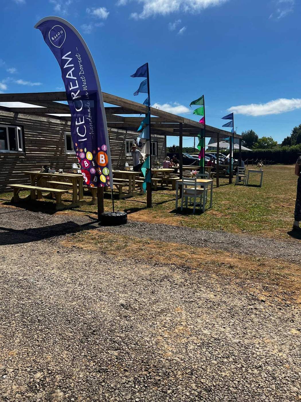 Outdoor tables and an ice-cream flag at Bloomin’ Lovely Flower Farm