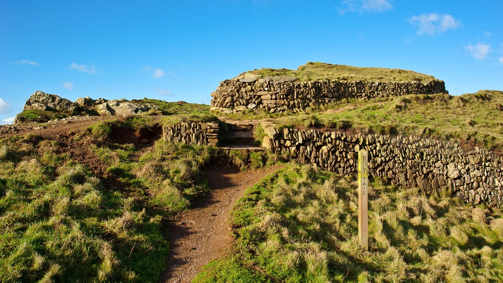 Stone walls and steps at the entrance to the Bolt Tail hillfort