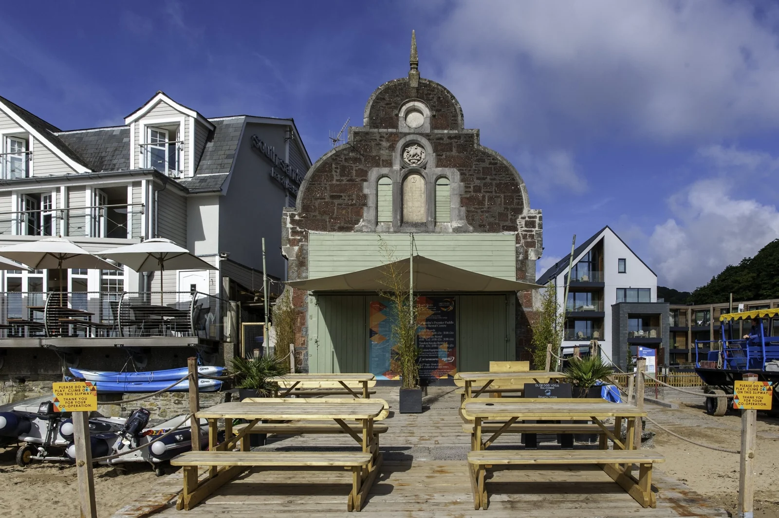 Bo’s old lifeboat house frontage and picnic tables