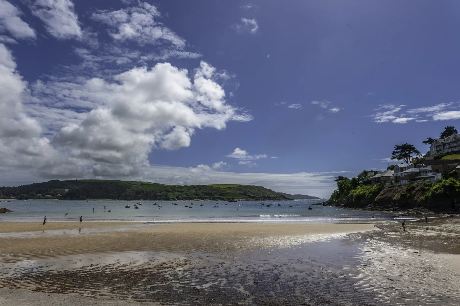 South Sands beach and estuary under a blue sky