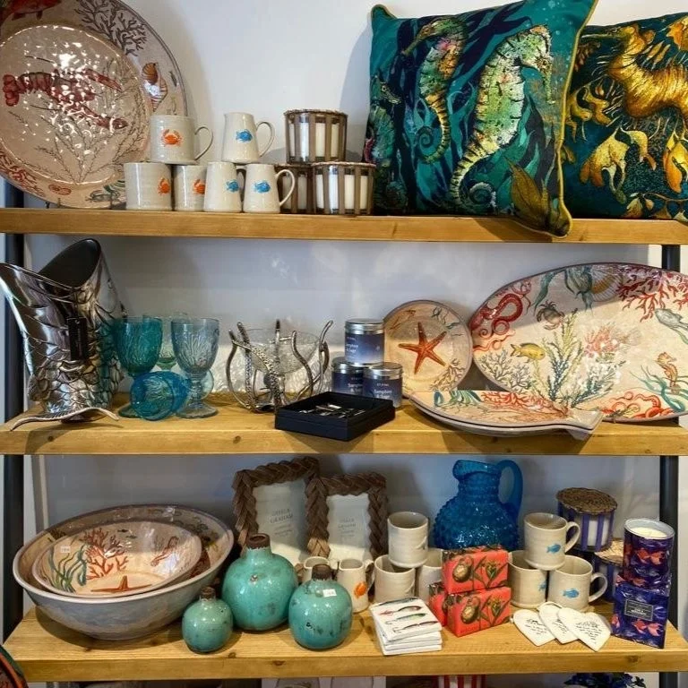 Colourful cushions and ceramics on shop shelves