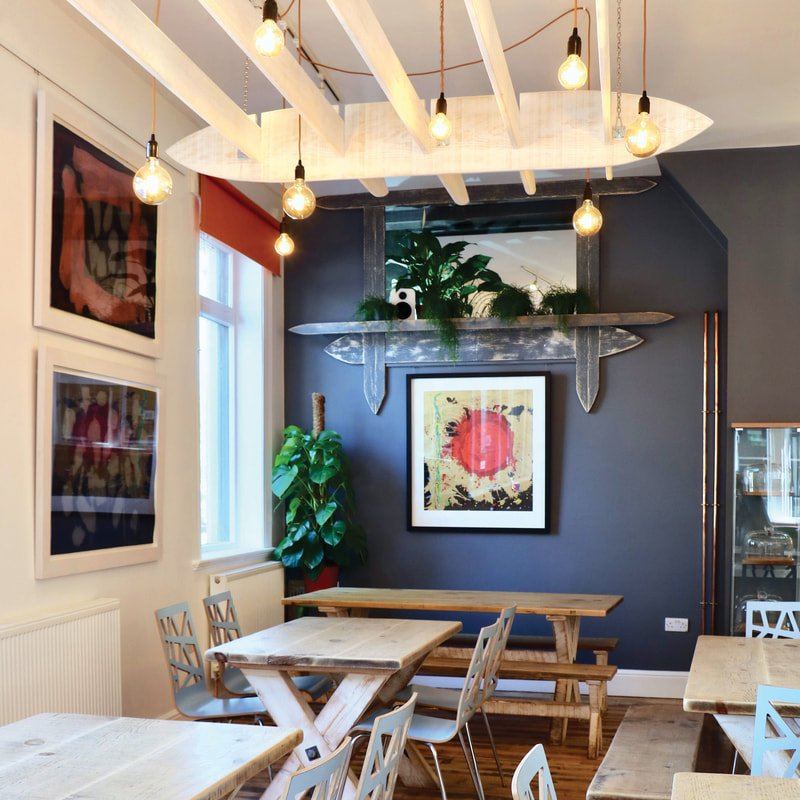 Brook Kitchen dining room with artwork and pendant lights