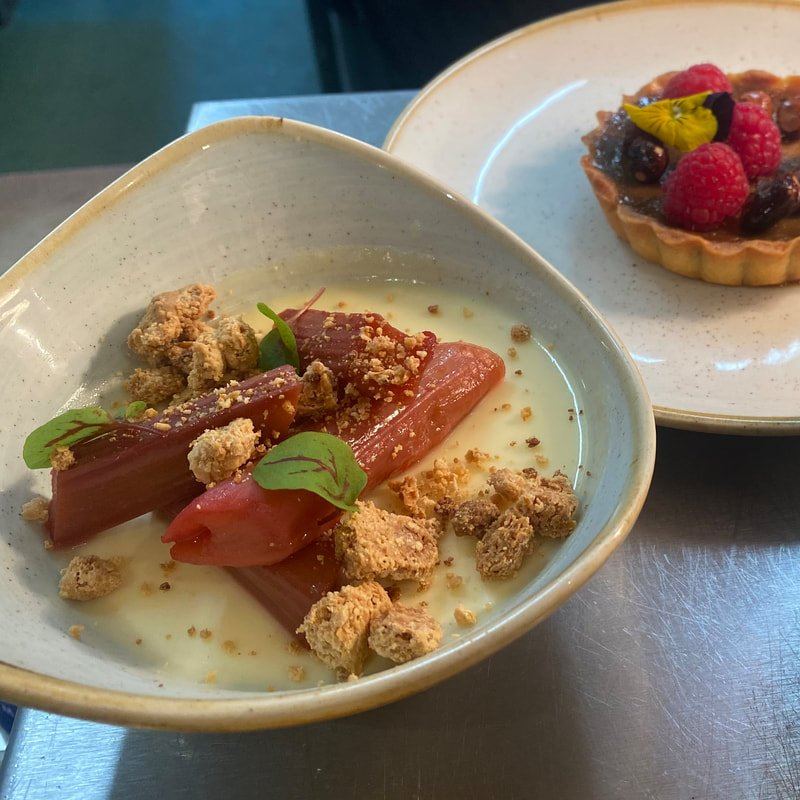 Dessert with fruit on a ceramic plate at Brook Kitchen