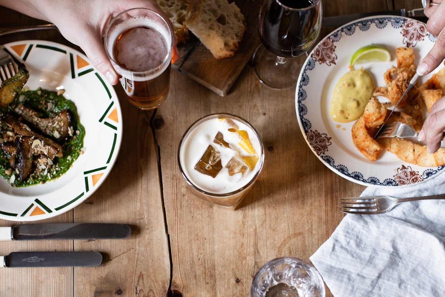 Seasonal plates and bread on a wooden table at The Bull Inn