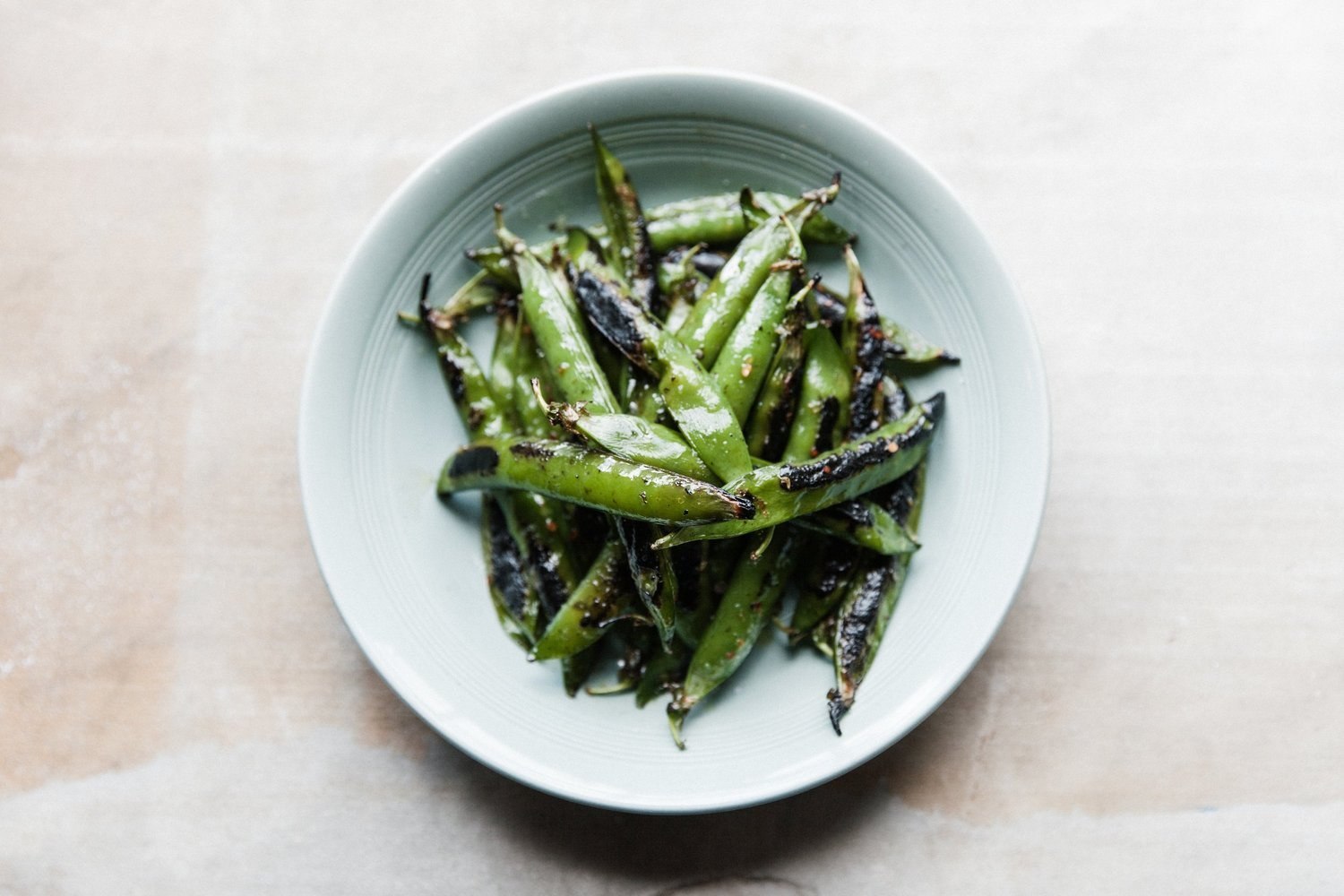 A bowl of charred green vegetables from The Bull Inn kitchen