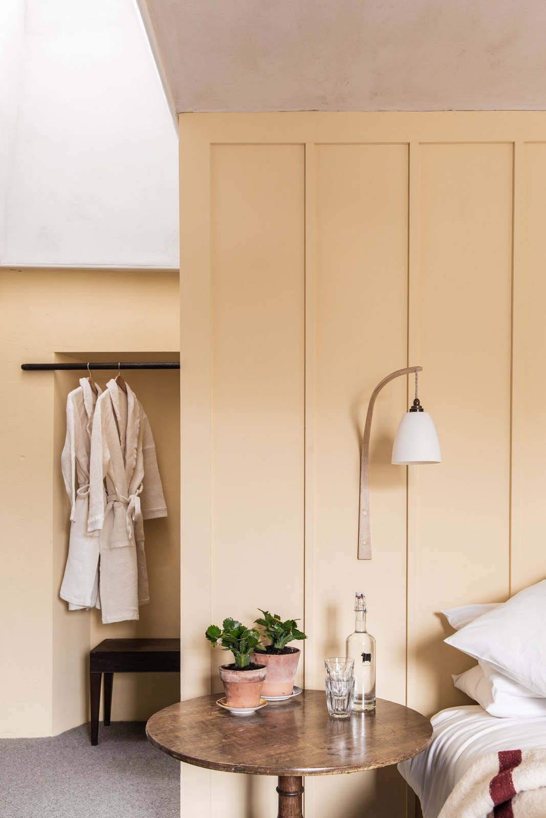 A softly coloured guest bedroom at The Bull Inn