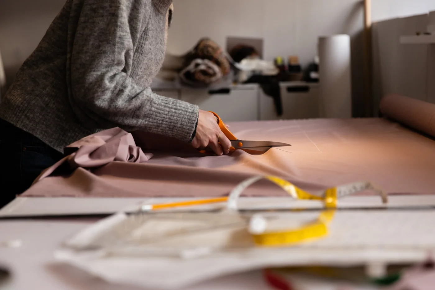 Fabric being cut by hand in Butterwalk’s sewing studio