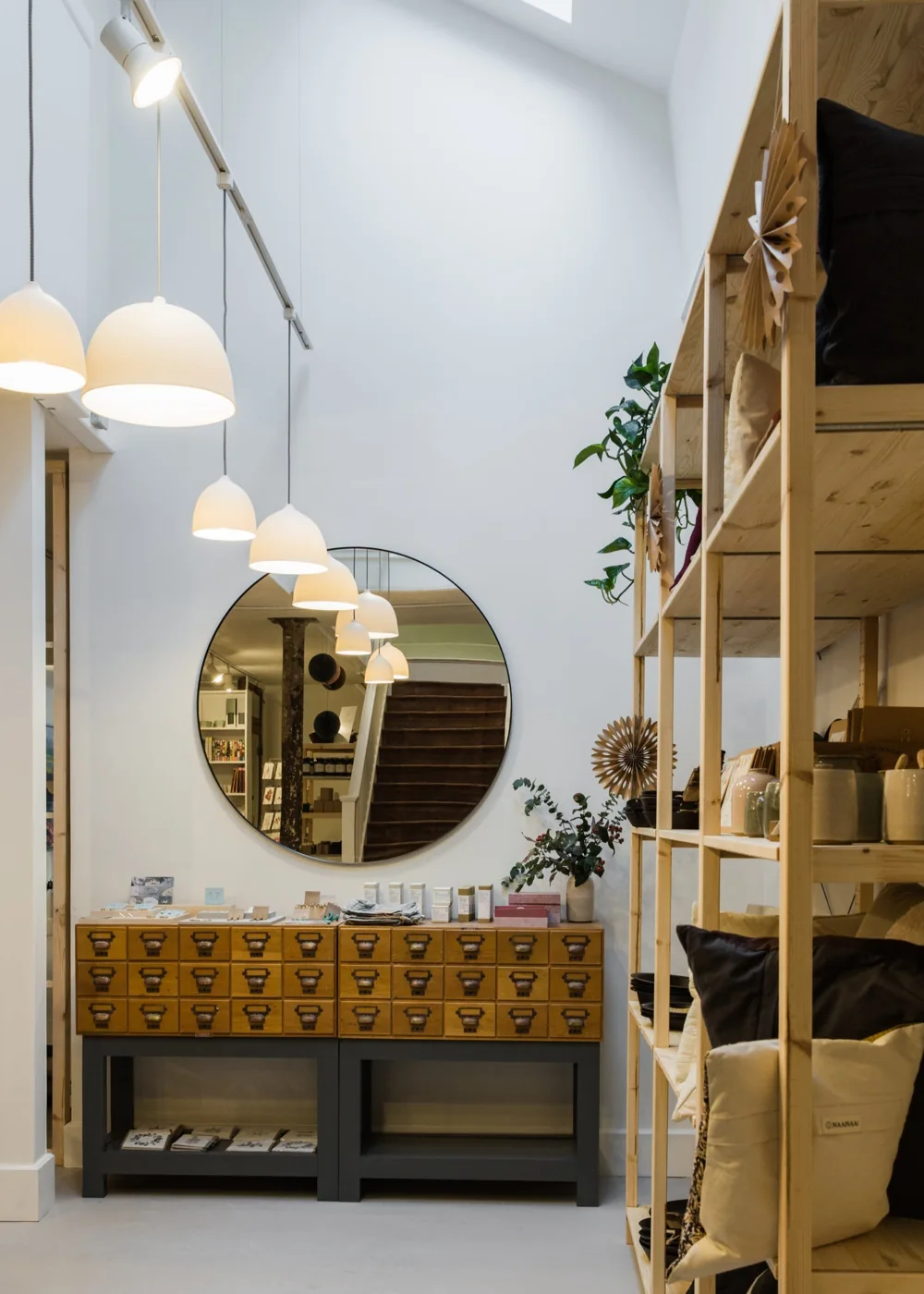 Wooden cabinet and pendant lights inside Butterwalk