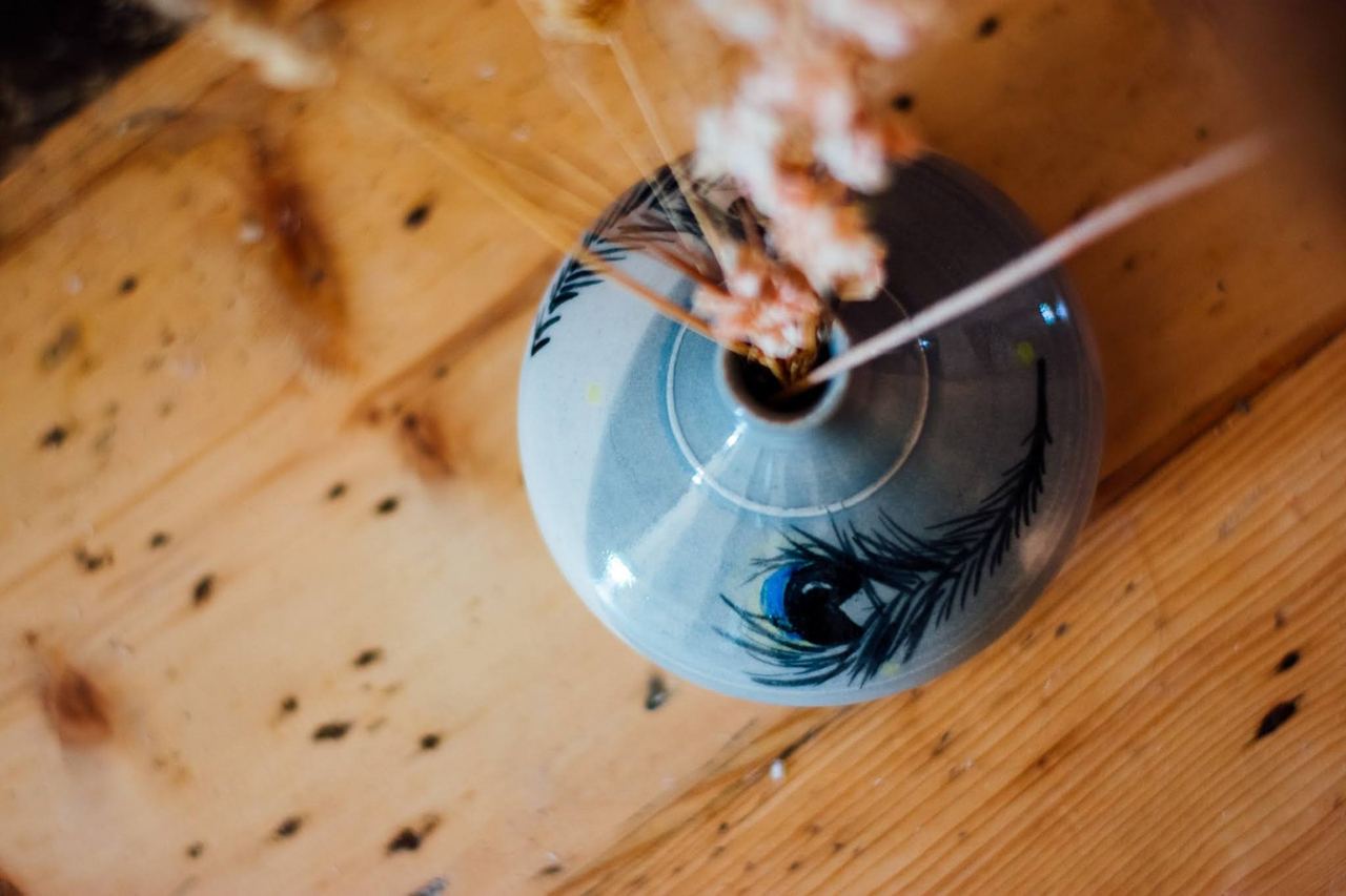 Paintbrushes standing in a blue handmade jug