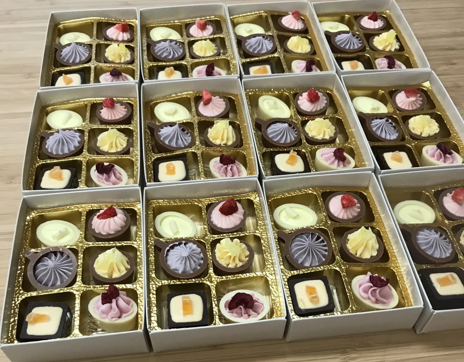 Gift boxes filled with colourful handmade chocolates