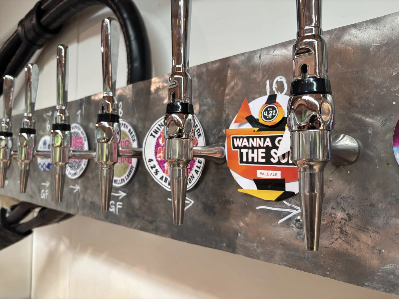 A row of craft beer taps at CLASH Taproom