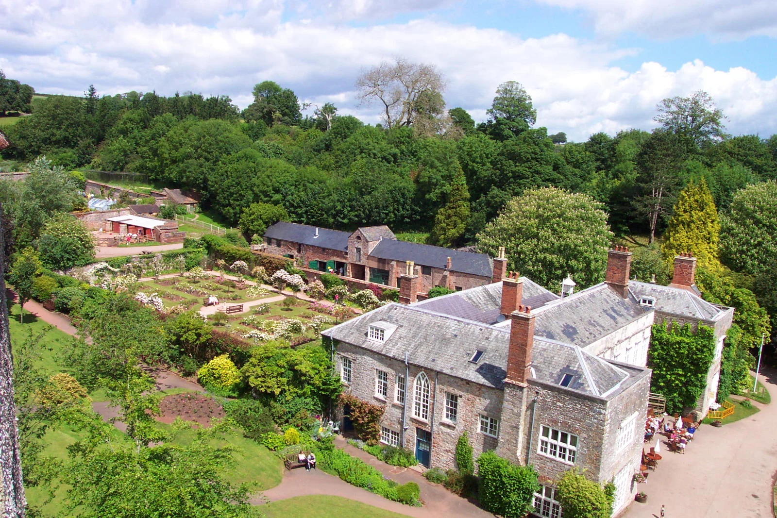 An aerial view of Cockington Court, gardens and studio buildings