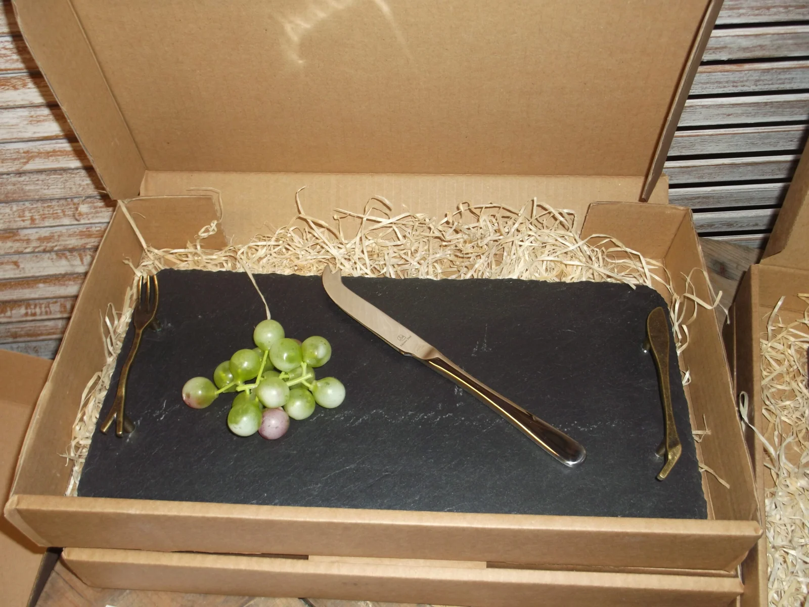 A boxed handmade glass serving board in the Craft Shop