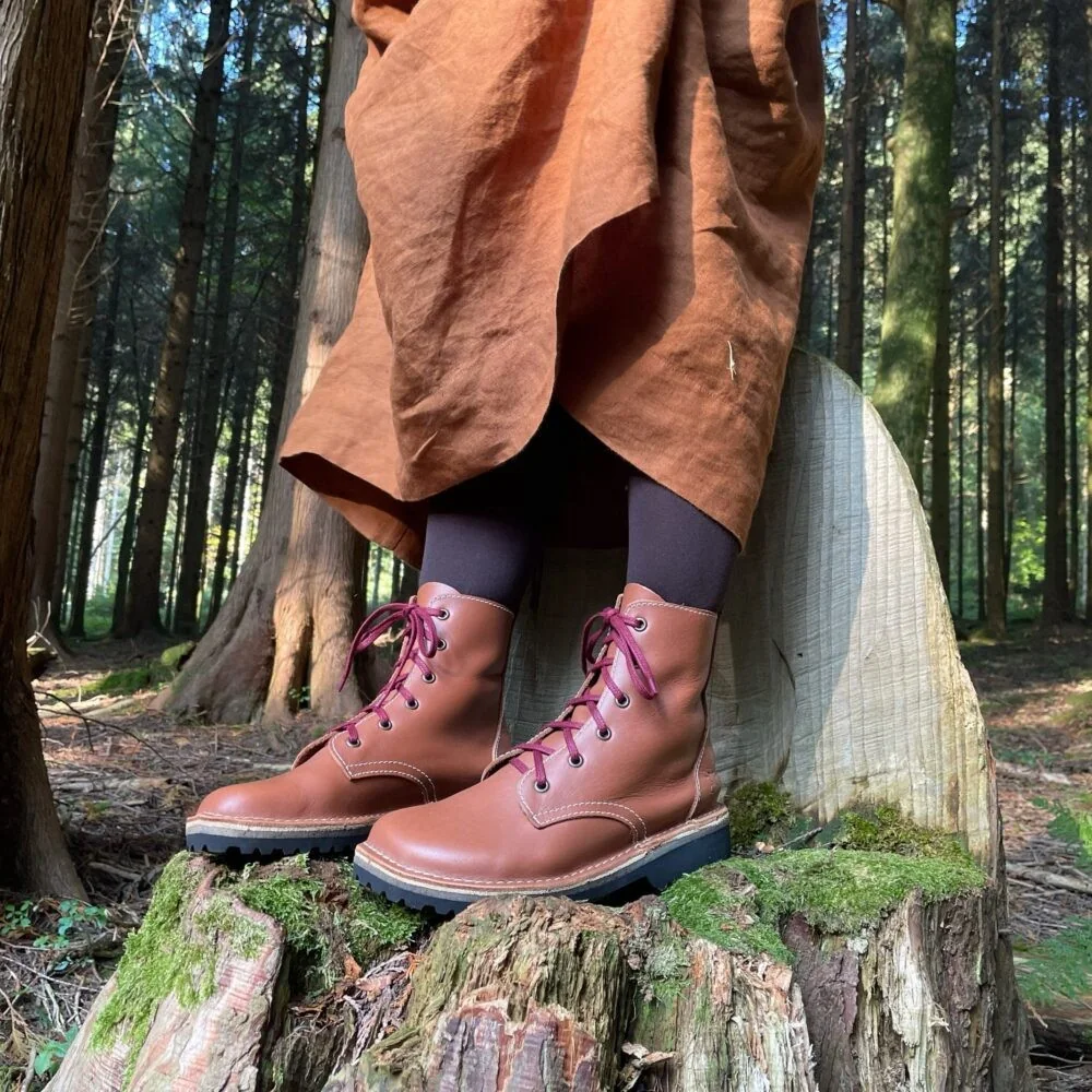 Pink leather Conker boots worn in woodland