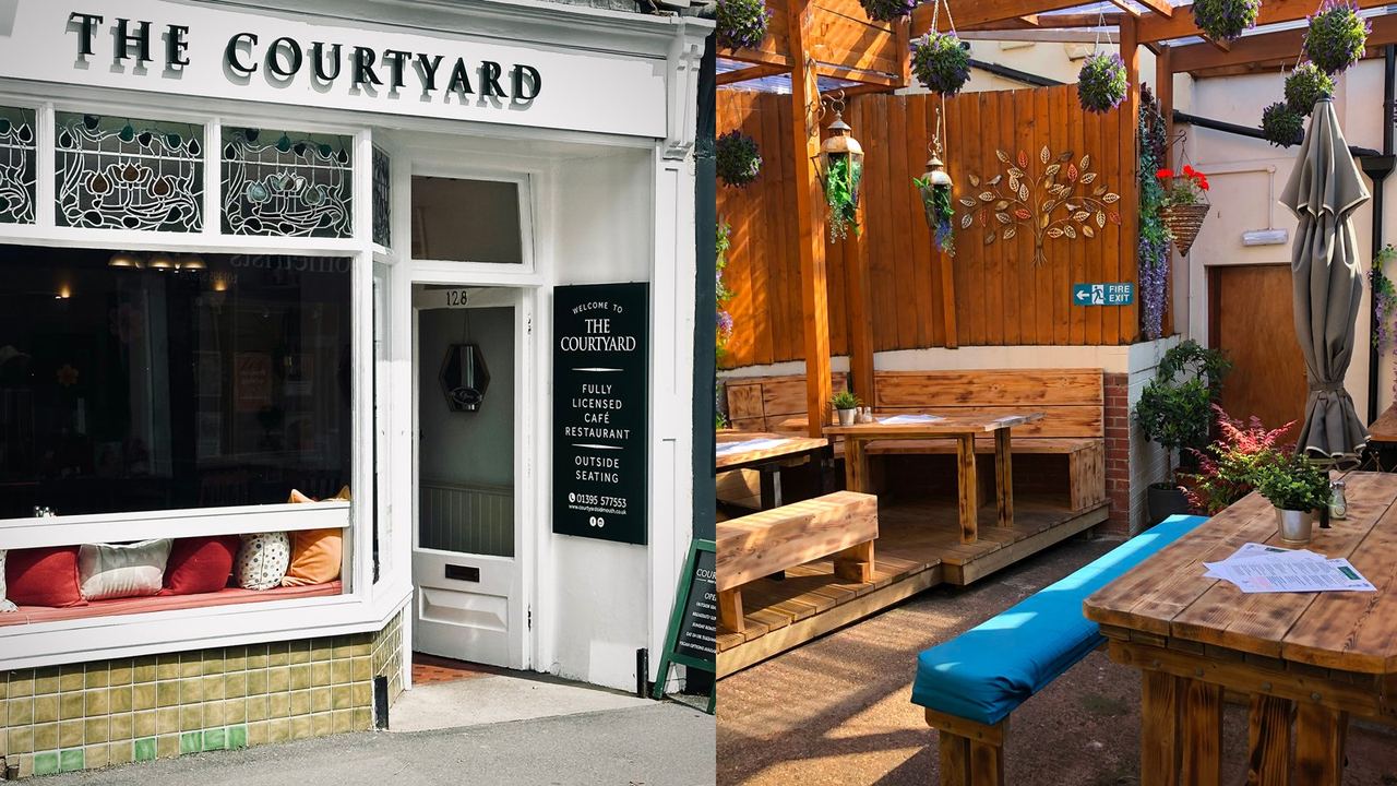 The Courtyard café frontage and plant-filled seating area
