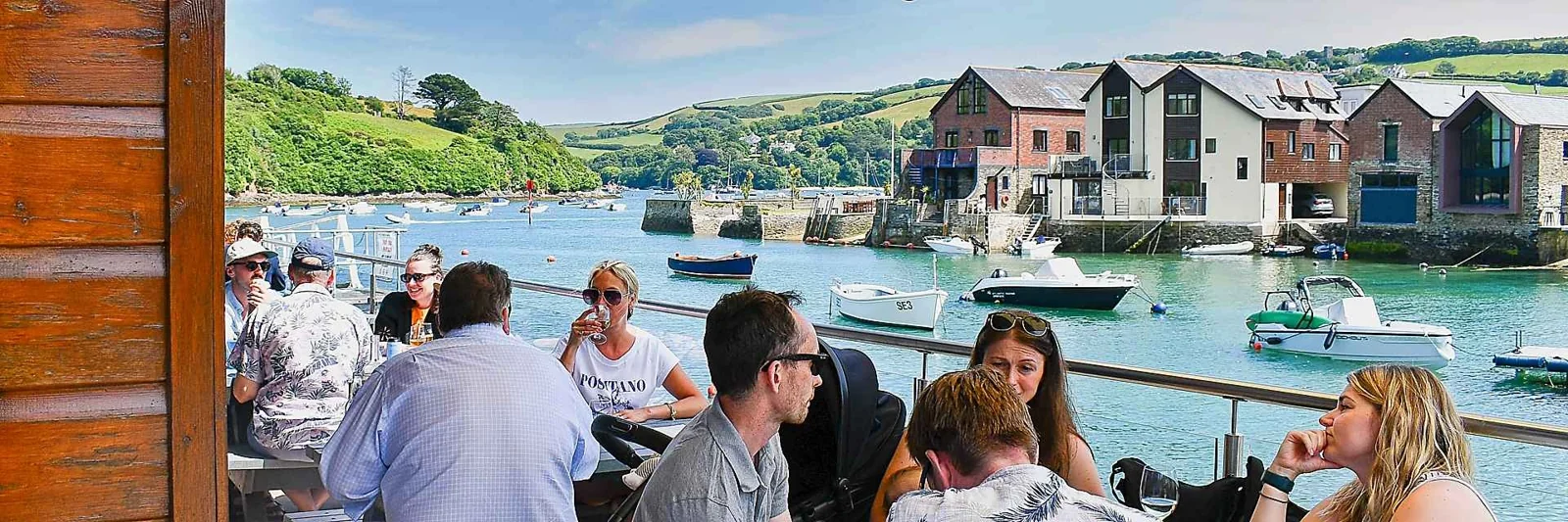 Diners beside the harbour at Crab Shed Salcombe