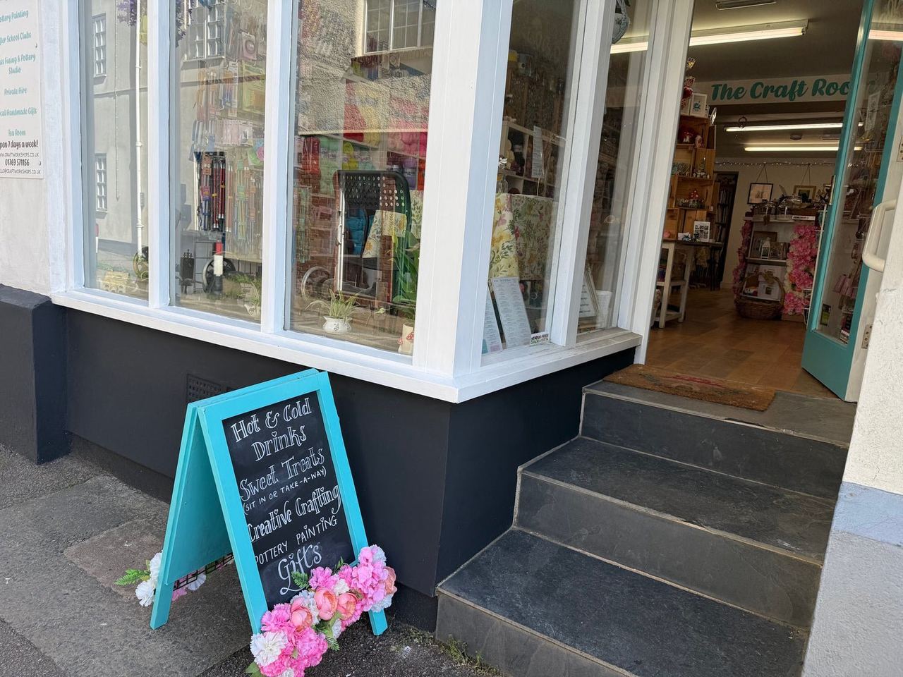 The Craft Room shopfront with open door and steps