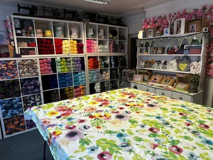 Colourful craft materials and a large making table at The Craft Room