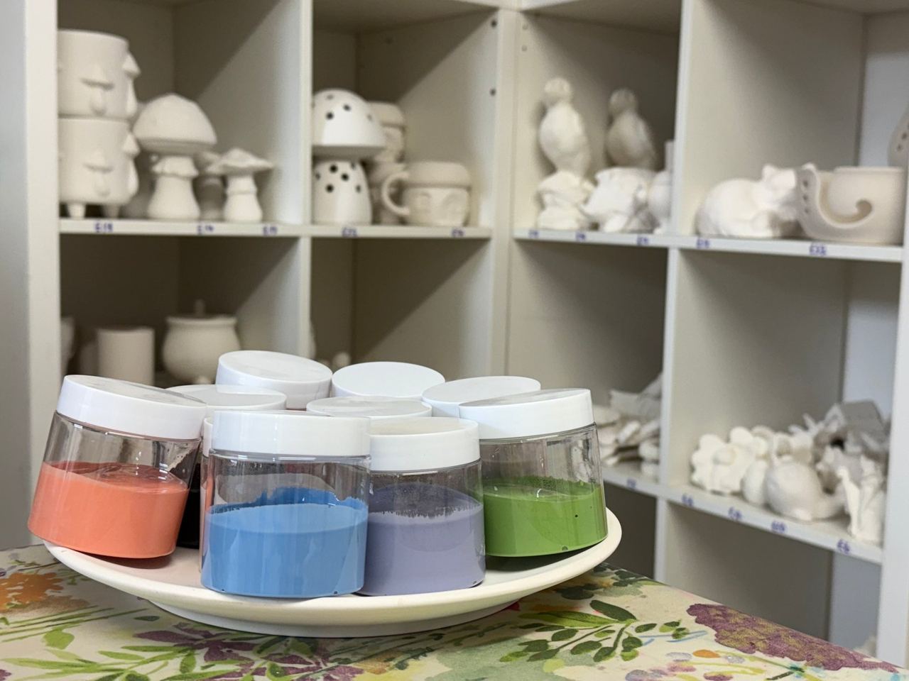 Blank pottery and tubs of colour for painting