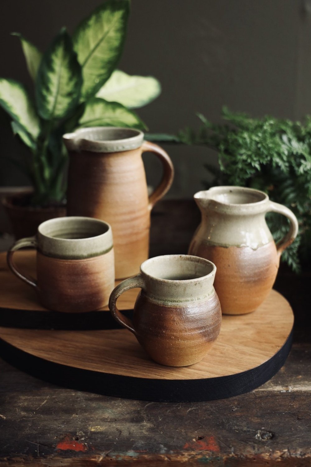 Earth-toned ceramic cups and jugs at Craftmongers