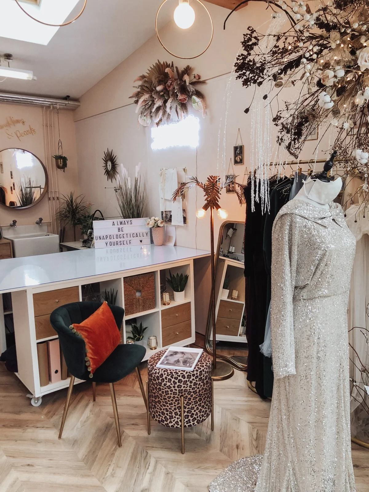 Dressmaking table and bridal gowns inside Dandelions and Pearls