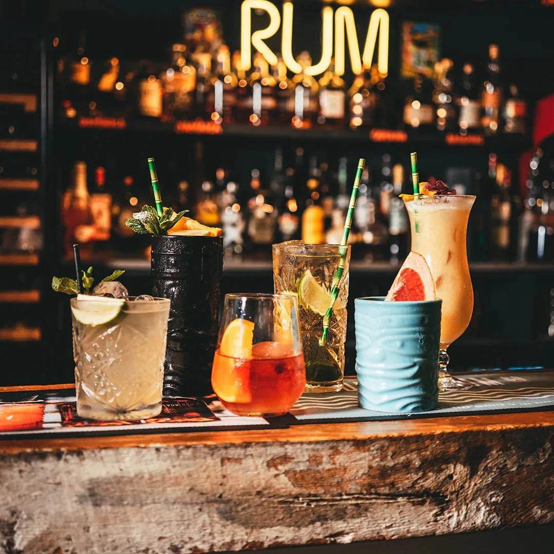 Cocktails and bottles on the Devon Rum Bar counter