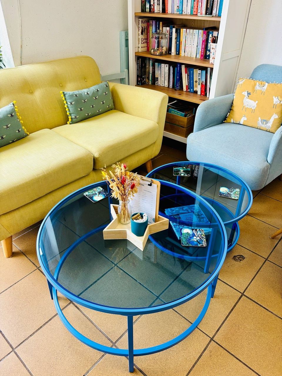 Colourful tables and a yellow sofa at Devonmade