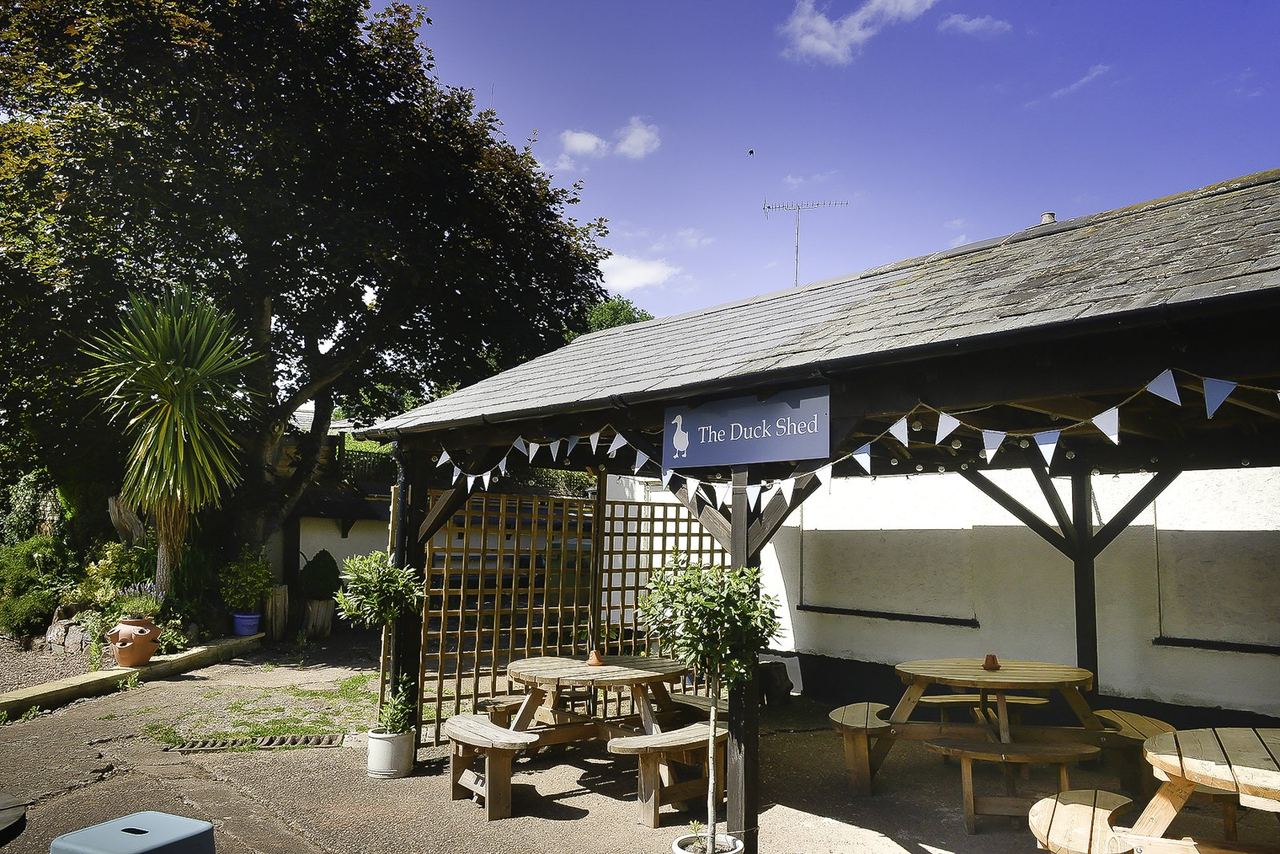Covered seating in The Duck garden