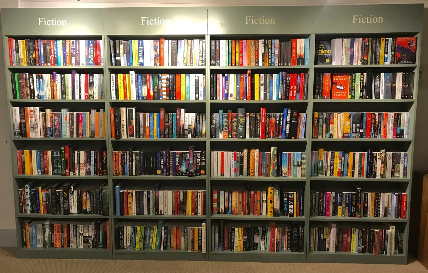 Colourful rows of fiction books on the shop’s shelves