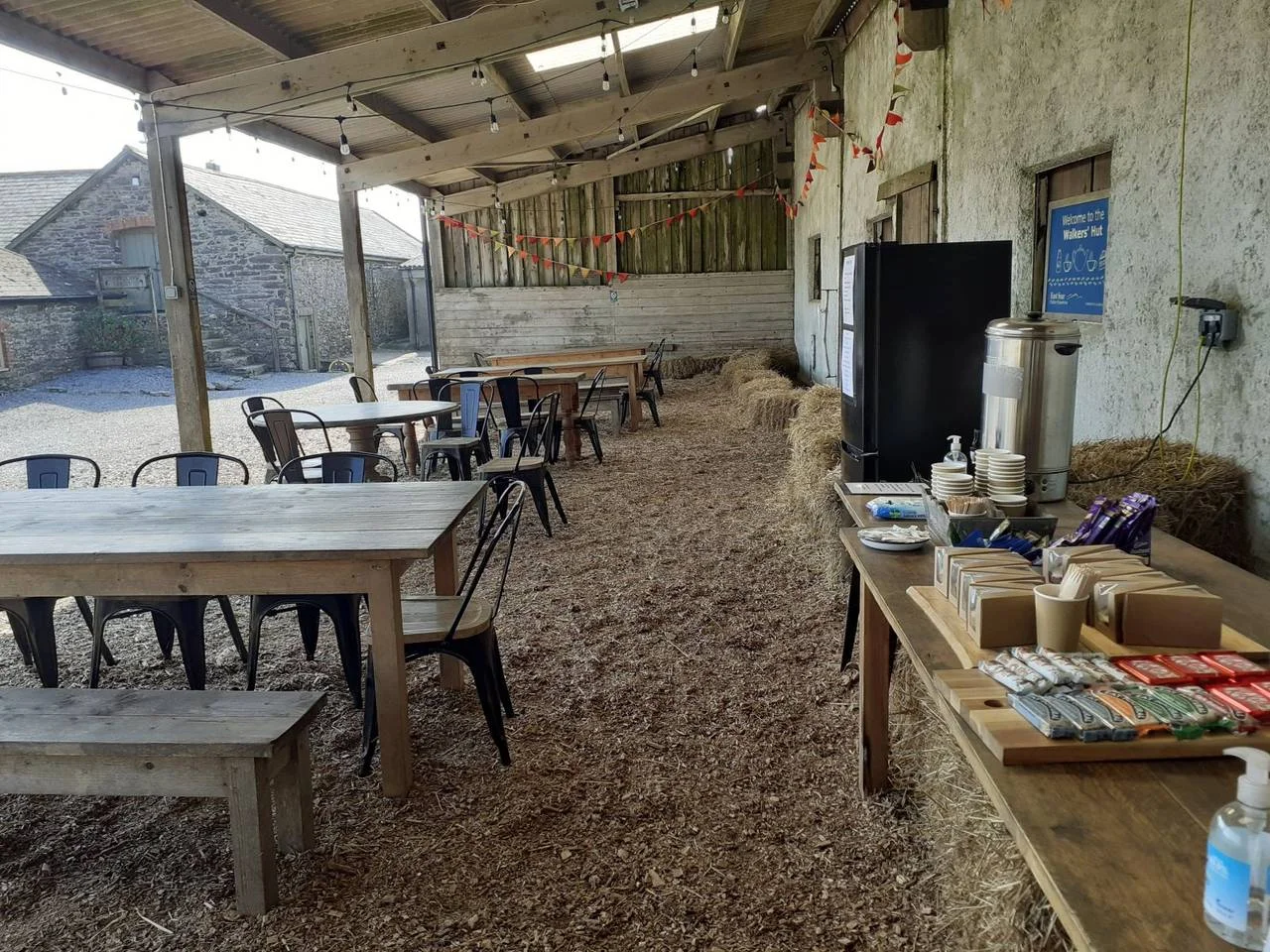 Covered seating and a self-service counter inside the Walkers’ Hut