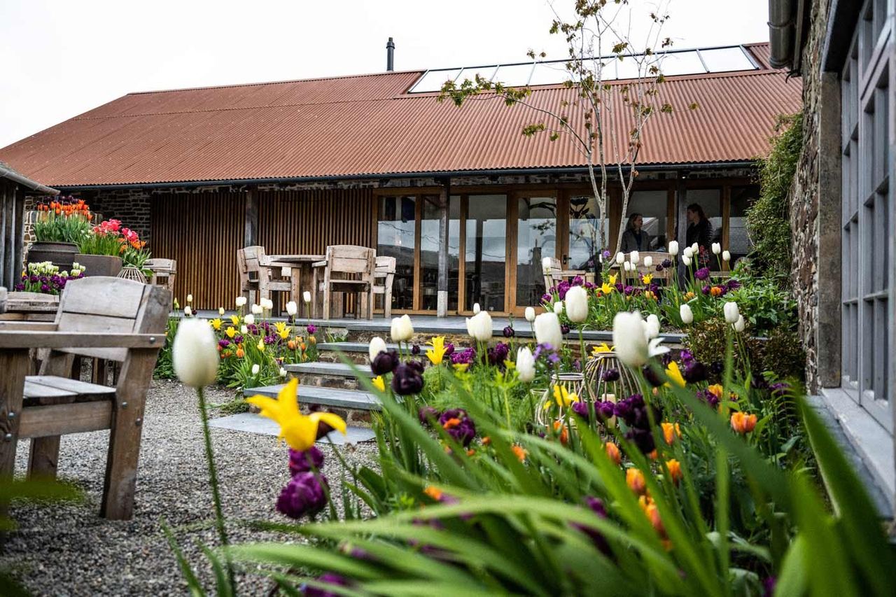 Flowers and outdoor tables in the pub garden