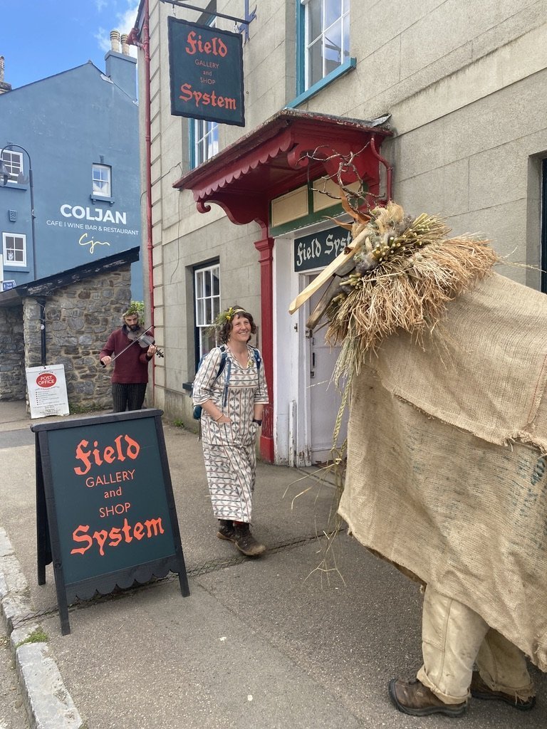 The Field System entrance on West Street with a costumed folk figure