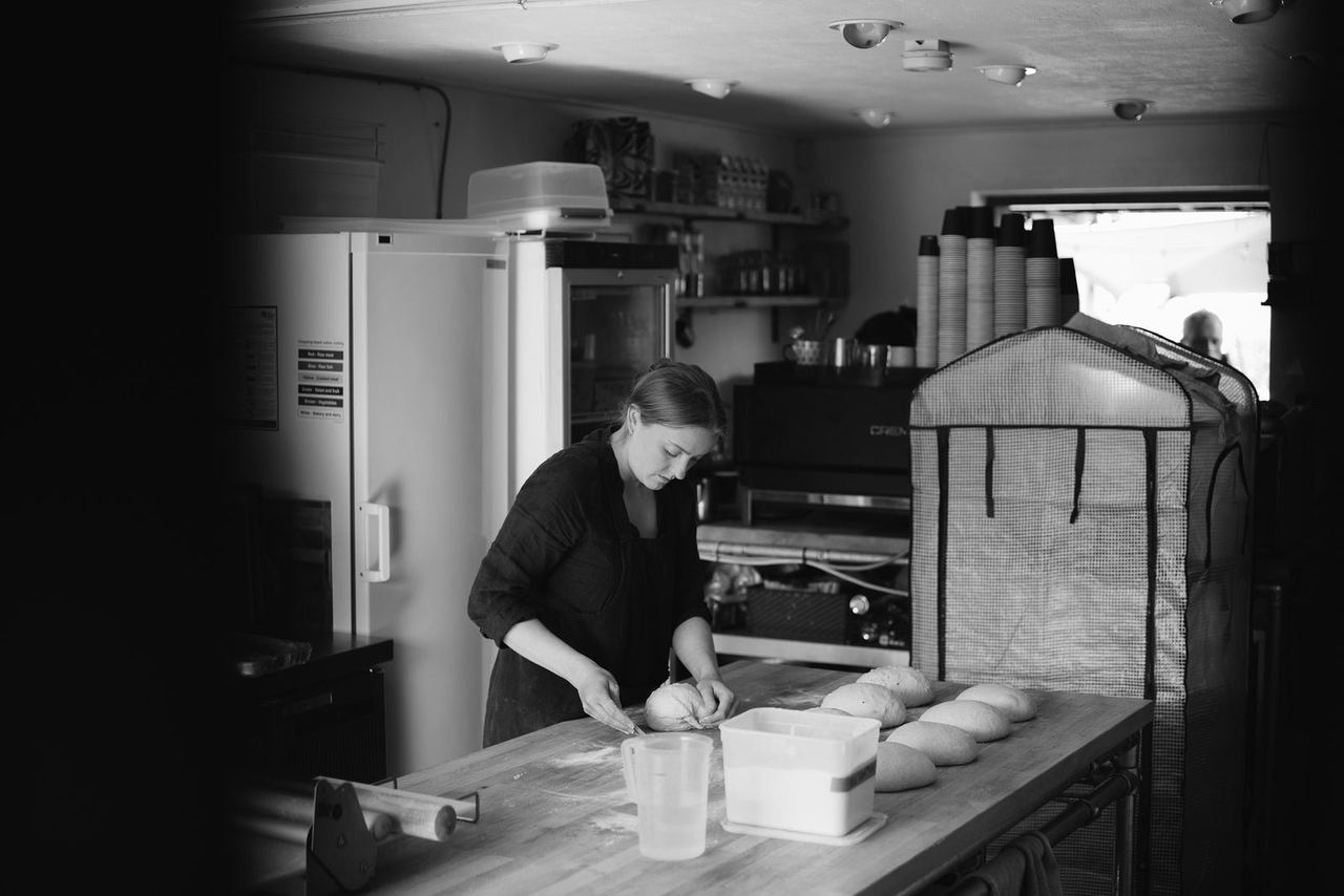 Baker working with dough at Finns