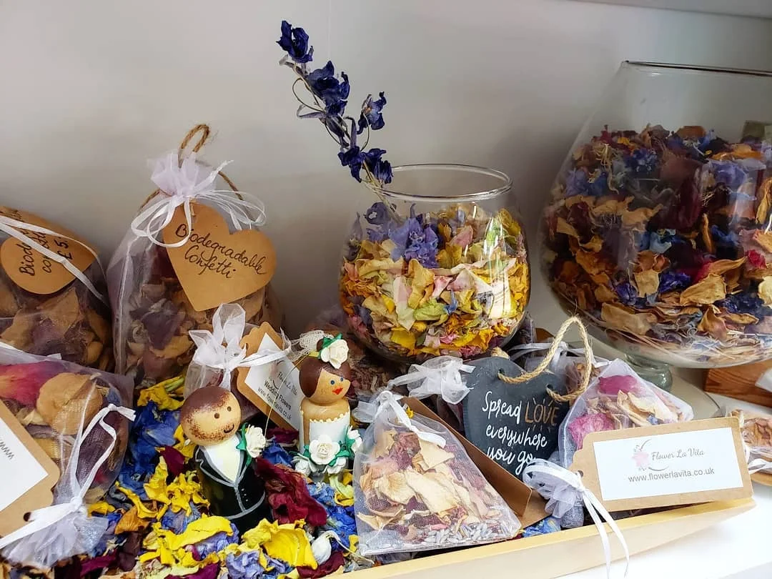 Small decorated arrangements and gifts on a display shelf