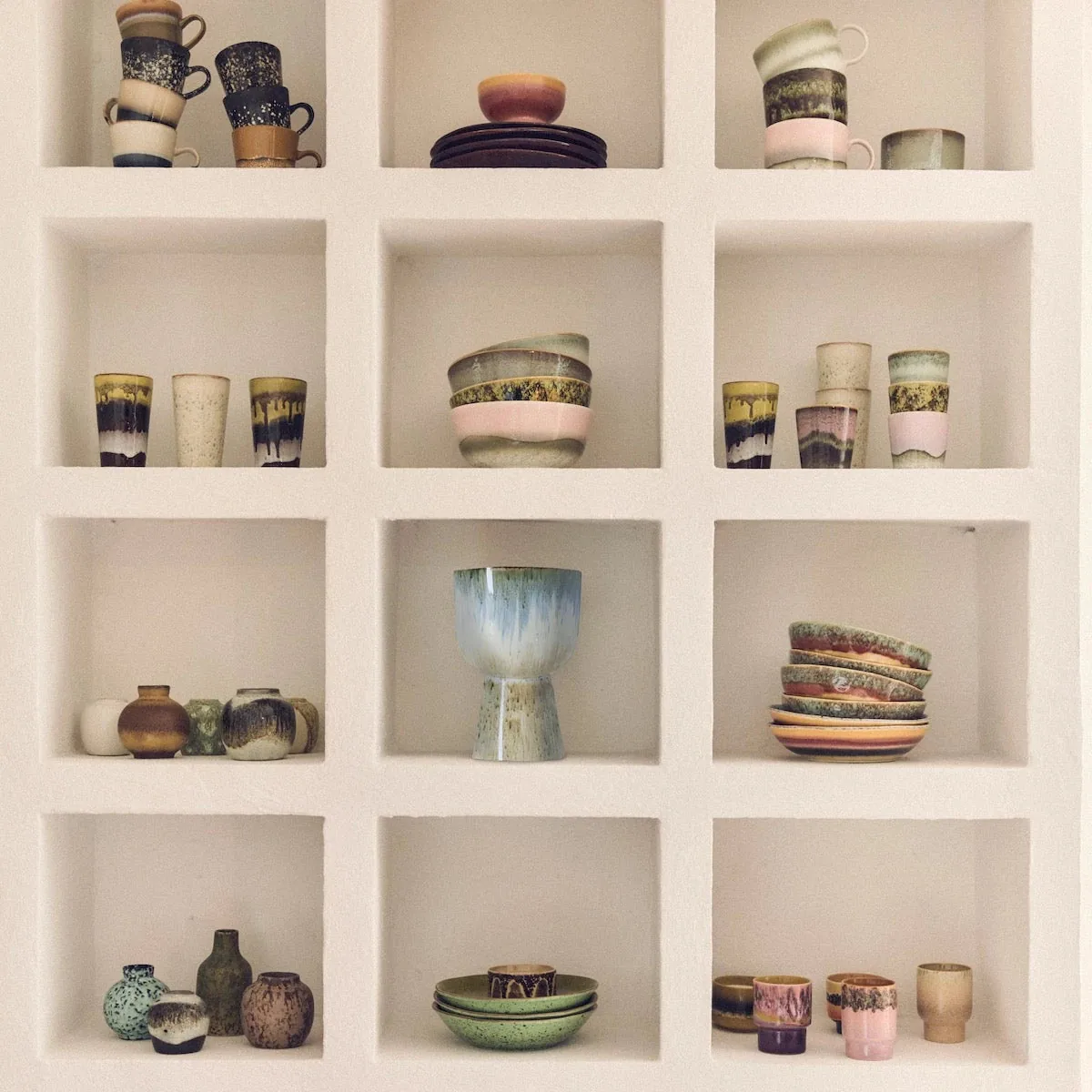 HKLIVING ceramics arranged in white shelving in a collection photograph supplied by Folk Interiors