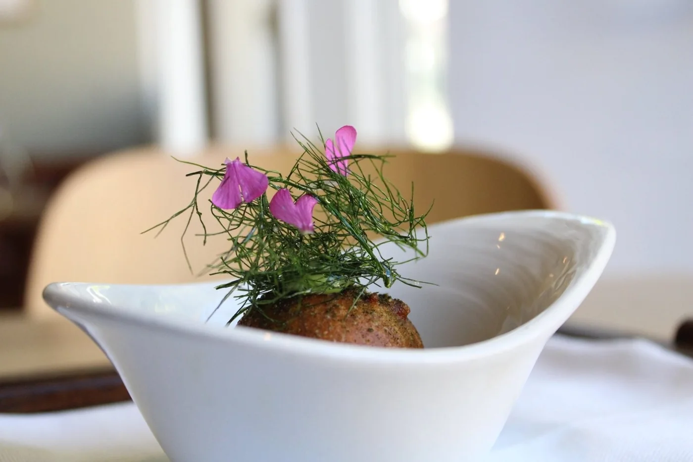 An intricately garnished dish at Gather