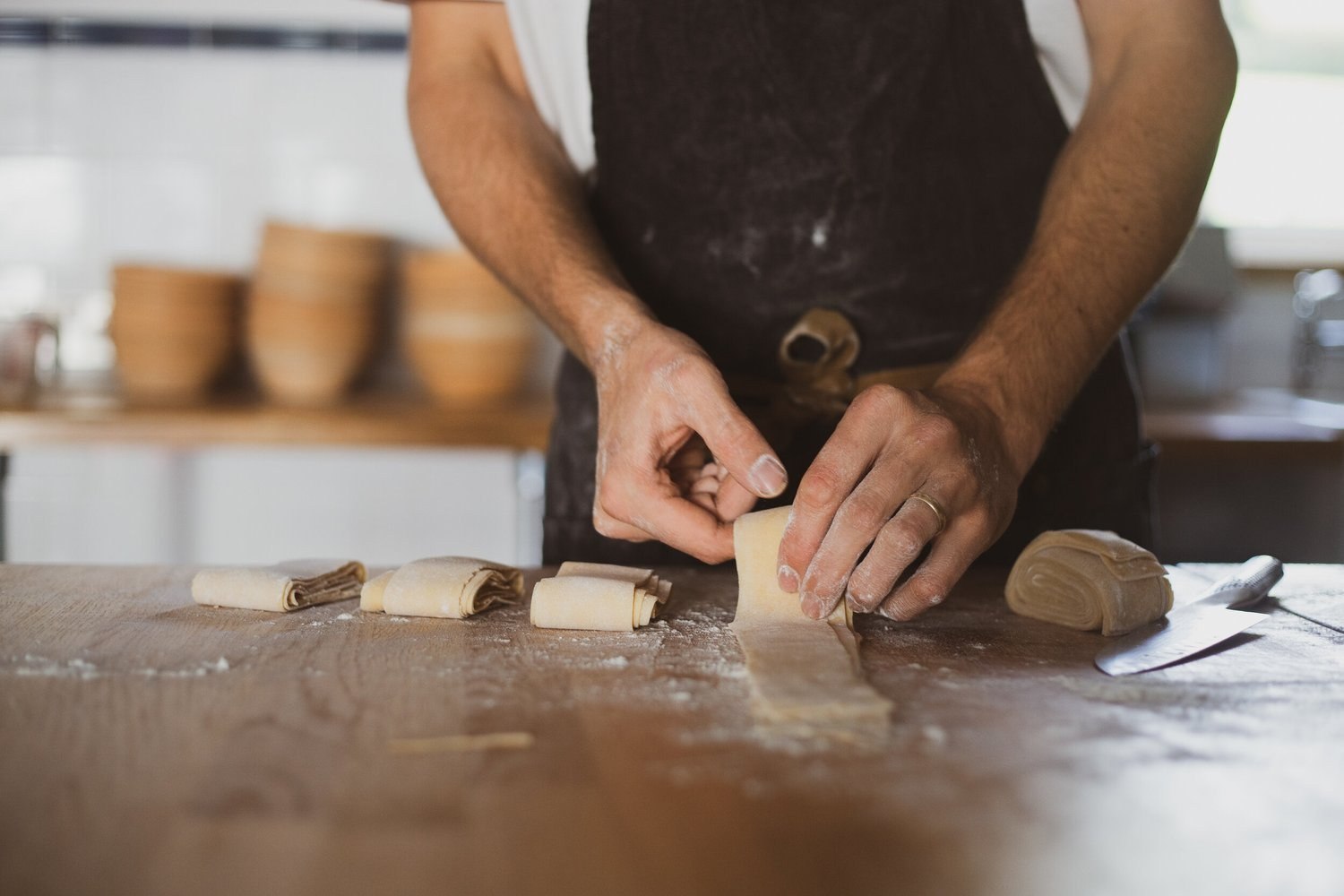 Hands preparing fresh pasta in the Glebe House kitchen