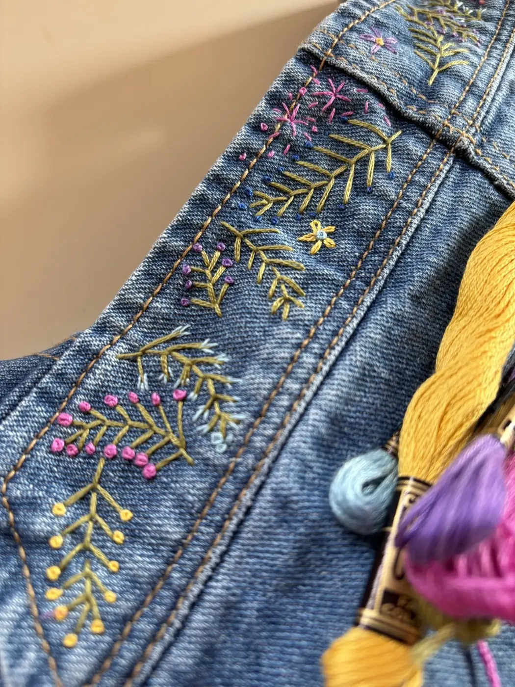Colourful embroidery on denim